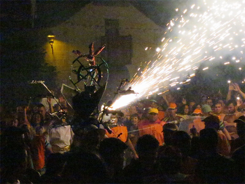 Wire frame dragonfly, with lit fireworks wooshing sparks El Borrachito fiesta, Mazo, La Palma